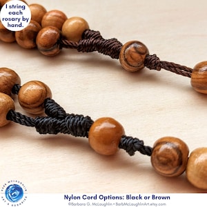 Your choice of black or brown nylon cord. I string each rosary by hand with durable nylon cord.