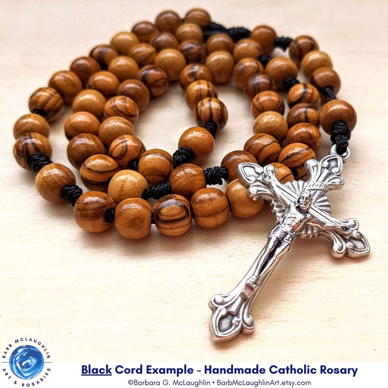 Handmade Catholic rosary with movable 8mm authentic Holy Land olive wood beads, large Italian-made crucifix (2.13 inches in length), and durable black nylon cord.