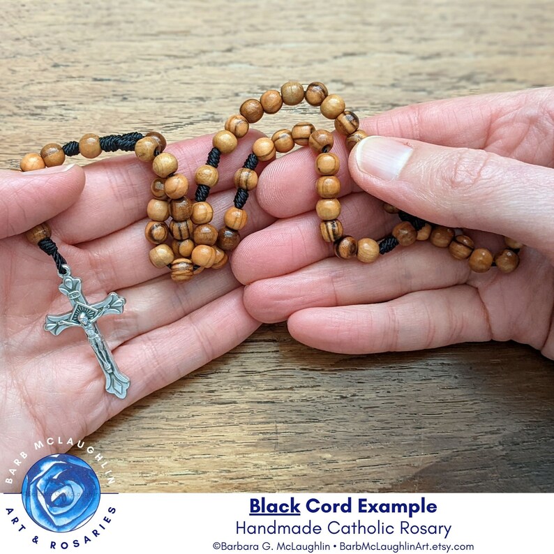 I inspect each bead when stringing rosaries by hand. This rosary is small enough to fit in the palm of the hand. Black nylon cord rosary shown in image.