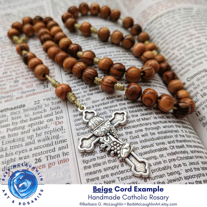 This five decade rosary makes a lovely First Communion gift for boys or girls. The metal cross is very detailed with the chalice with grape leaves, bread, grain below the chalice. The nylon cord is tied in barrel knots for stability and durability.