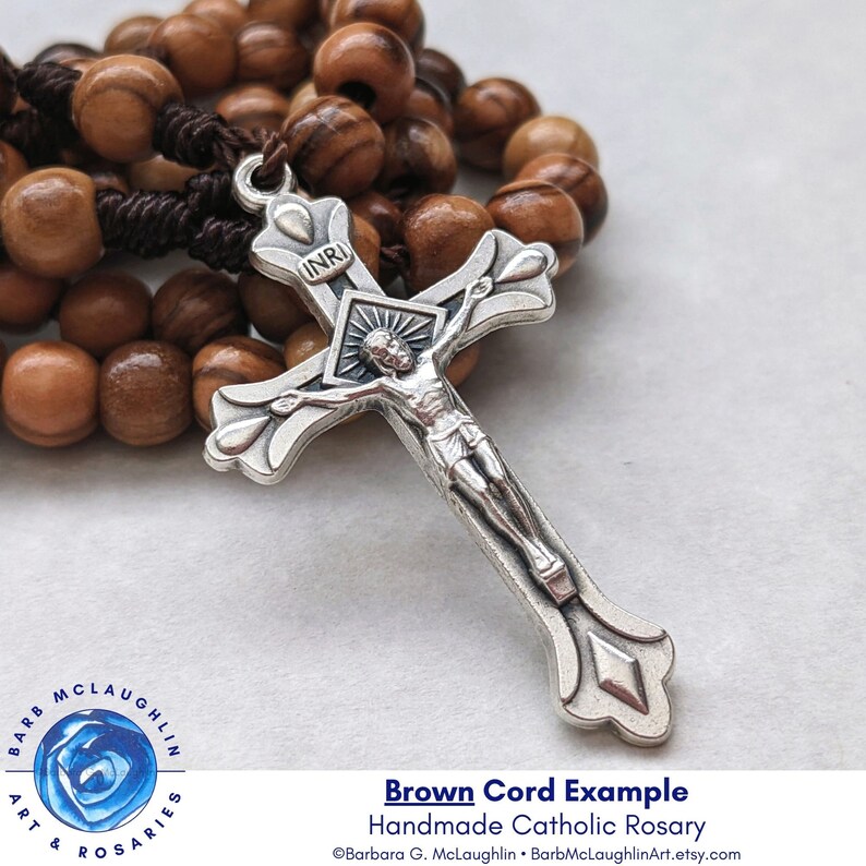 Handmade Catholic rosary with movable 6mm authentic Holy Land olive wood beads, beautiful metal crucifix, and durable brown nylon cord. My traditional five decade rosary is a lovely Catholic gift for men and women.