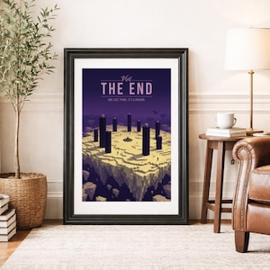 May include: A framed rectangular wall art print featuring a purple and yellow digital illustration of a blocky landscape with tall black pillars. The text reads Visit THE END and ONE LAST THING. IT'S A DRAGON. The print is in a black frame.