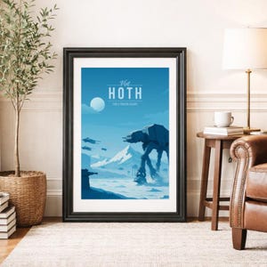 May include: Framed poster featuring a blue and white illustration of a snowy landscape with a large AT-AT walker and the text "Visit Hoth for a Frozen Escape." The poster is in a black frame and is displayed on a wall.