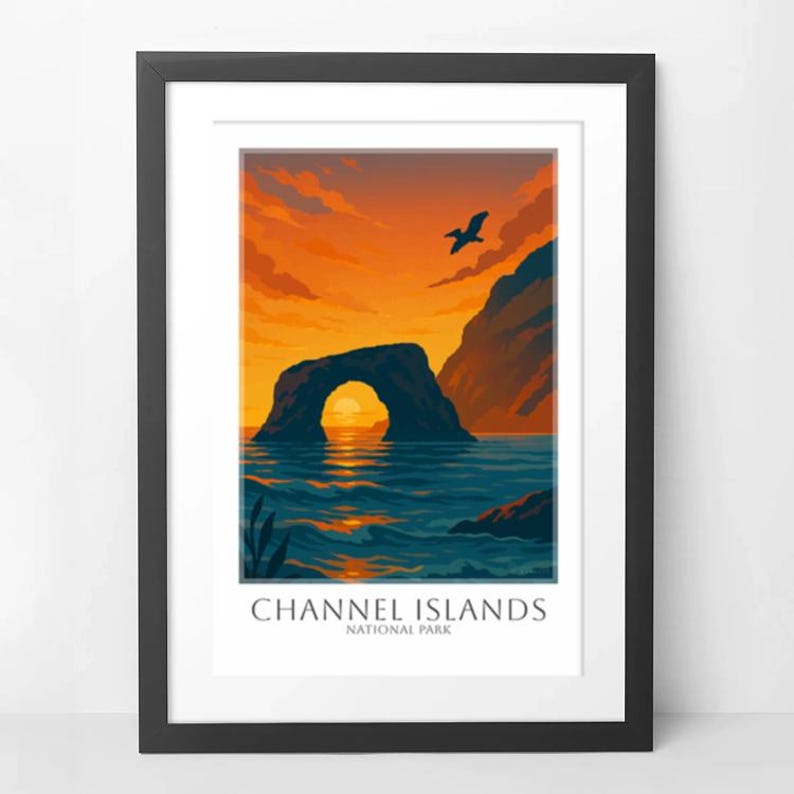 May include: Framed art print featuring a scenic view of the Channel Islands National Park. The artwork depicts a natural rock arch over the ocean at sunset, with a bird in flight. The text "CHANNEL ISLANDS NATIONAL PARK" is at the bottom.