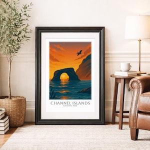May include: Framed art print featuring a scenic view of the Channel Islands National Park. The artwork depicts a natural archway over the ocean at sunset, with a bird in flight. The print includes the text "CHANNEL ISLANDS NATIONAL PARK".