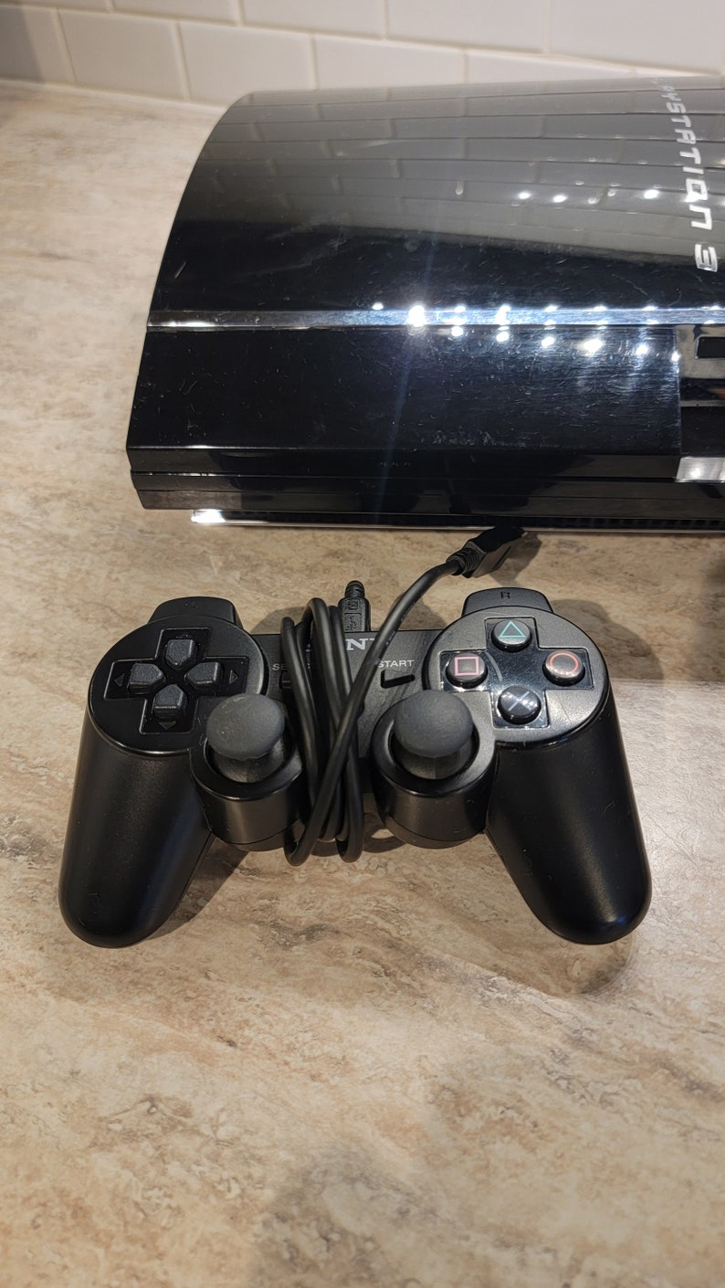 Sony Ps3 Playstation With 3 Controllers, 2 Memory Cards and Cords