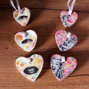 Set of heart-shaped clay ornaments. Handmade hearts decorated with watercolor and collage to hang. 2 models to choose.