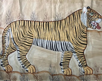 May include: A hand-painted tiger illustration in a walking pose. The tiger has a yellow and black striped coat, with a white belly and face. The tiger's mouth is open, revealing its tongue. The background is a light brown color with sparse vegetation.
