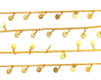 May include: A gold chain necklace with multiple strands and small round gold charms hanging from each strand.