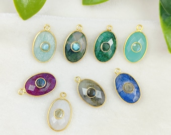 May include: Nine gold oval-shaped pendants with different colored gemstones and a small blue gemstone in the center of each pendant.