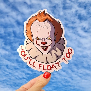 May include: A red and white sticker with a cartoon image of Pennywise the clown from the movie IT. The sticker has the text "You'll Float Too" in red and black.