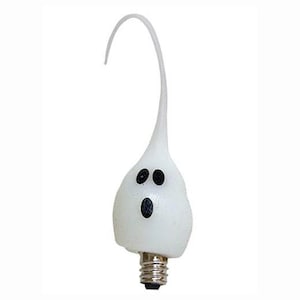 May include: A white, ghost-shaped light bulb featuring a smooth, rounded body with a pointed top. The face consists of two small, black, oval-shaped eyes and a larger, black, oval-shaped mouth. A standard metal screw base is attached at the bottom.