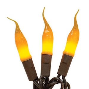 May include: Three flame-shaped light bulbs with a yellow and orange gradient, attached to brown bases and wires. The bulbs are designed to resemble flickering flames, creating a warm, inviting glow. Ideal for decorative lighting.