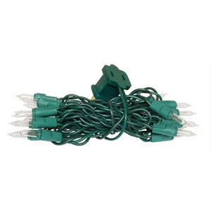 May include: A string of 50 clear Christmas lights with green wire and a green plug.