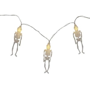 May include: A string of decorative lights featuring three small, grey skeleton figures. Each skeleton has a glowing, translucent yellow skull head and is connected by a thin, dark wire, creating a continuous line of illuminated figures.