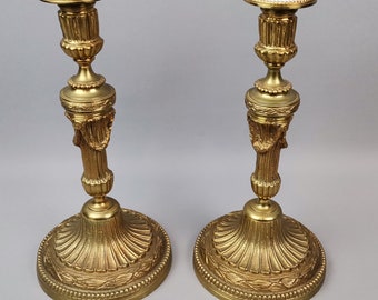 Couple of Candlestics of the XVIII / XIX Century in Gilded Bronze. France