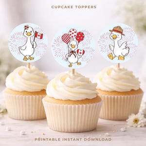 May include: Three cupcakes topped with round toppers featuring cartoon geese with Canadian flag and balloon designs. The toppers are on wooden sticks, and the cupcakes have white frosting. Text at the top says "CUPCAKE TOPPERS" and at the bottom "PRINTABLE INSTANT DOWNLOAD".