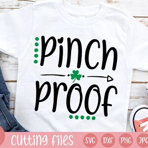 May include: White t-shirt featuring the text "Pinch Proof" in black script, with green dot accents and a shamrock. The shirt is part of a collection of cutting files, with the Hay Hay Beans logo in the lower left corner.
