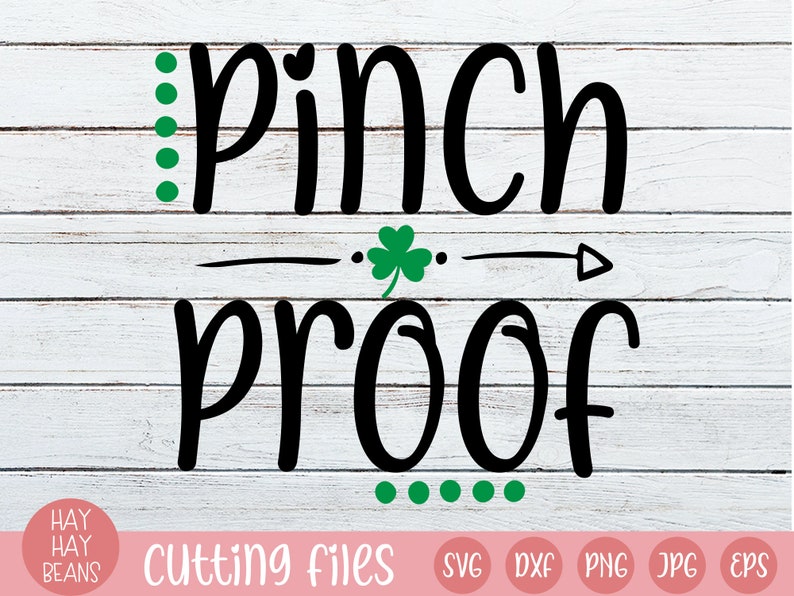 May include: A St. Patrick's Day graphic on a white wood-effect background. The words "Pinch Proof" are in bold black font, with green accents including dots and a shamrock. The bottom of the image includes file type icons.
