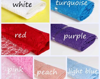 May include: A collection of lace fabric rolls in various colors, including white, turquoise, red, purple, pink, peach, and light blue. The fabric is delicate and has a floral pattern.