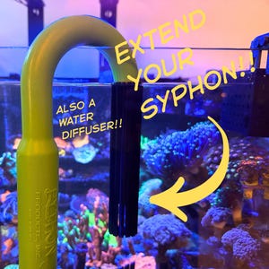 May include: A lime green aquarium siphon extension with a black diffuser. The text reads "EXTEND YOUR SYPHON!!" and "ALSO A WATER DIFFUSER!!". The background shows a colourful aquarium with coral.