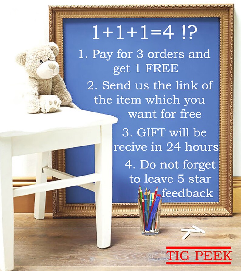 May include: A blue framed chalkboard with the text "1+1+1=4 !?". A stuffed teddy bear sits on a white table. A glass of colored pencils and the text "TIG PEEK" are also visible.