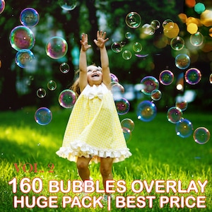 May include: A young girl in a yellow and white checkered dress jumps in a grassy field with her arms raised as she watches colorful iridescent bubbles float in the air.