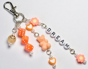 Orange “dream” beaded keychain, beaded bag charm, dangly keychain
