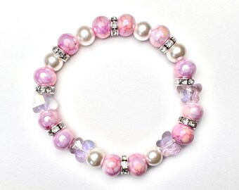 Pink and white glass butterfly beaded bracelet, with silver rhinestone beads, 6.5 inch stretchy beaded bracelet