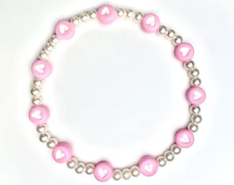 Pastel pink heart beaded bracelet, with plastic pearl beads, 7 inch stretchy beaded bracelet