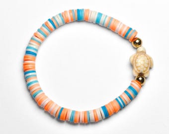 Blue and orange clay bracelet with white turtle, 6.5 inch stretchy beaded bracelet