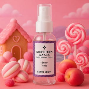 May include: A clear room spray bottle with a white top and a purple label that reads "Northern Waxes, Snow Pixie, Room Spray." The background features pink lollipops, candies, and a gingerbread house.