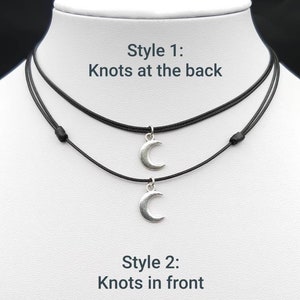 May include: Two black cord necklaces with silver crescent moon charms. The necklaces are shown in two styles: one with knots at the back and one with knots at the front. "Style 1: Knots at the back" and "Style 2: Knots at the front" are written in white text on a white background.