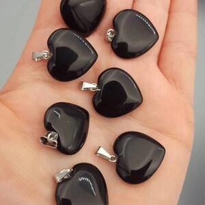 May include: Six black obsidian heart pendants with silver bail loops. Each pendant is approximately 20mm in size. 20mm Obsidian heart pendant.
