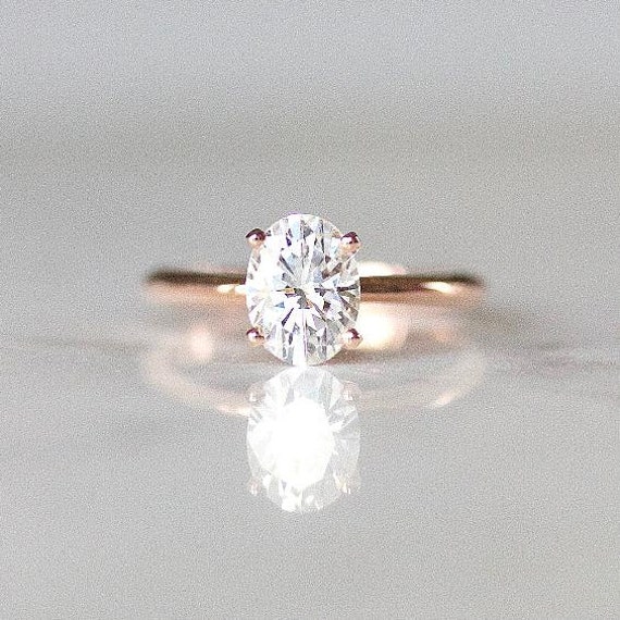 oval diamond with gold band