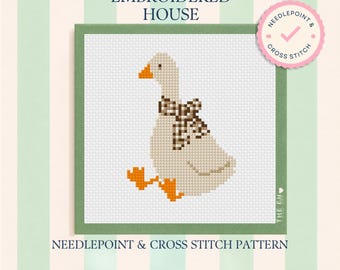 May include: A cross stitch pattern featuring a white goose with an orange beak and feet, wearing a brown and white checkered neck ribbon. The design is labeled The Embroidered House and includes a pink circular badge stating Needlepoint & Cross Stitch.