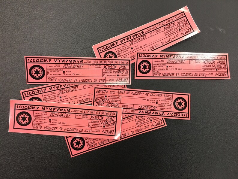 May include: A stack of pink paper cards with black text and a black and white symbol. The text on the cards reads "1200007 ҮИРИИЧИ4152126802 NWROW 10 47000074 ONNOM NUROW 07XYW 40M217207 30 47000ти Дикни ДИР МИ٤ ٤٨٨٨VIOODIL БИЛО WORLDDULT AS EKOLIPRON MANLO 1200007 МҮИРИЛЧИ4152726599 MONNA MORLANDOLT AS ERTLUPION MAXLO 07KYW 4041727 87 +7000VND NOME 1200007 МҮИРМИЧИ 10 BOUNTY NOW"