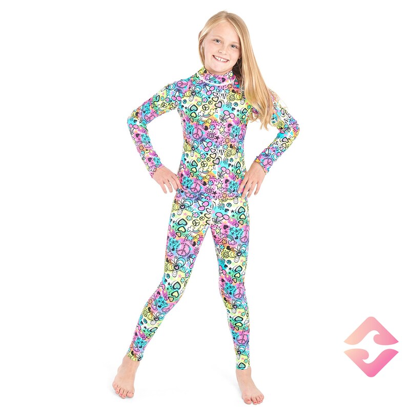 May include: A girl wearing a long-sleeved, one-piece outfit with a colorful, psychedelic print featuring peace signs, hearts, and other symbols. The outfit is made of a stretchy, comfortable fabric.