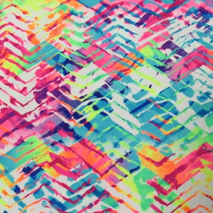 May include: Abstract pattern with a white background and a vibrant mix of colors. The design features a chevron pattern in shades of pink, orange, blue, green, and purple, creating a dynamic and eye-catching visual.