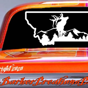 May include: White vinyl decal of a silhouette of an elk with antlers, standing on a mountain range, inside the outline of the state of Montana. The decal is on a black background.