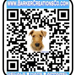 May include: Black and white QR code with a dog's head in the center. The text "www.barkercreationsco.com" is at the top of the image. The text "DECALS  HATS  APPAREL" is at the bottom of the image.