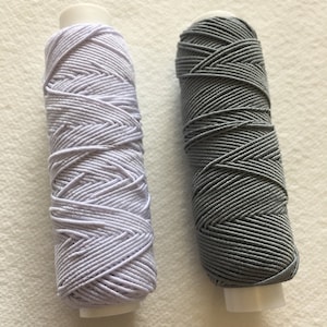 Shirring Shearing pack of 2 reels, White & Mid Grey ,Elastic Thread 20 metre spools ,spool,sewing, craft, dress making,smocking Elastic