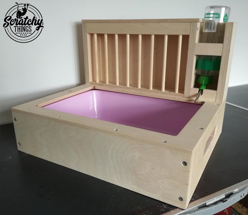 3in1 bunny rabbit hay feeder with built in litter box and a free standing water bottle holder hay feeder hay rack Nibbler Combo Mini