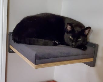 Wally Corner, Wall mounted cat shelf with a cushion on top