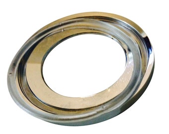 May include: A silver-toned metal ring with a smooth, polished finish. The ring has a circular shape with a slightly raised edge.