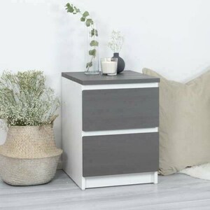 May include: A white and gray two-drawer nightstand with a wood-grain finish on the drawers. The nightstand is sitting on a light wood floor.