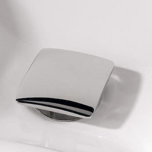 May include: A chrome-plated square-shaped bathroom sink drain cover.