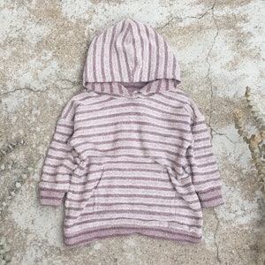 May include: A pink and white striped hooded sweater with a kangaroo pocket.