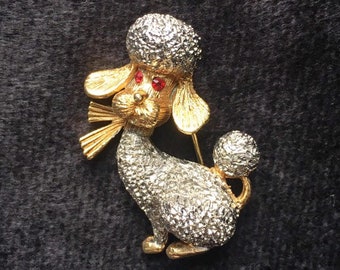 Poodle- gold tone, with white textured “fur”, and red rhinestone eyes- vintage pin/brooch