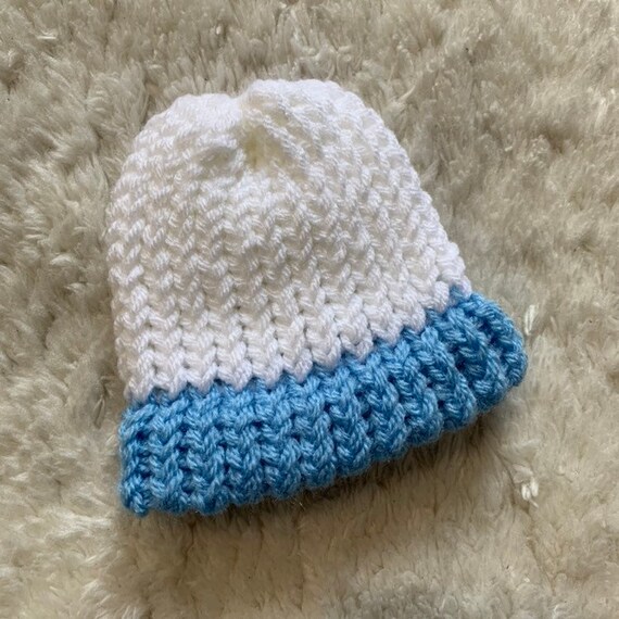 white knitted newborn hat